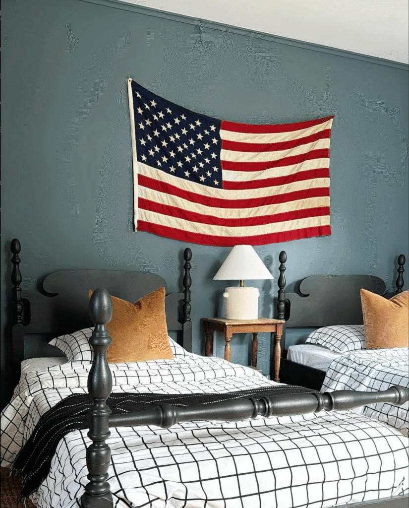 kids' bedroom with American flag, twin beds, and matching sheets